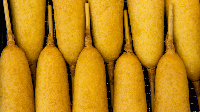 Corn dogs lined up in a row
