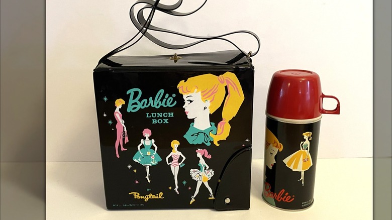 Black vinyl Barbie lunchbox with matching Thermos against white backgrop