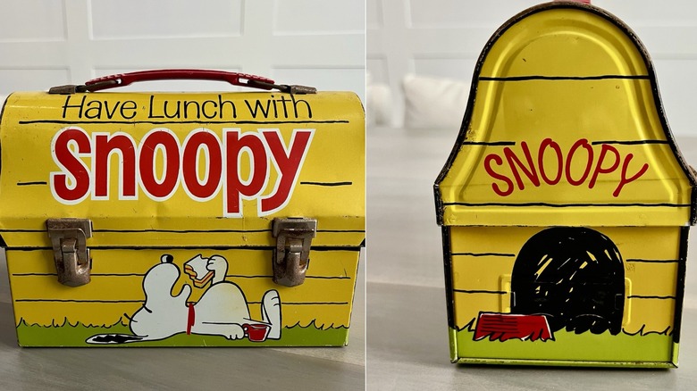Front and side view of vintage domed yellow lunch box in shape of Snoopy's dog house