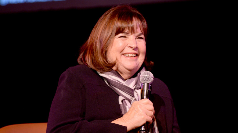 Ina Garten holding a microphone and smiling