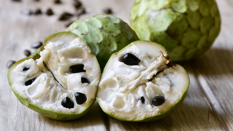 whole and halved cherimoya