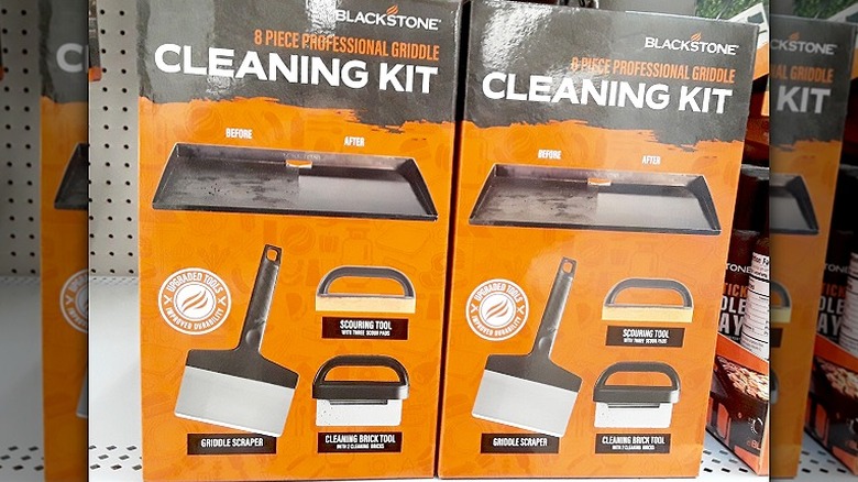Boxes of Blackstone Griddle cleaning accessories sit on a retail shelf