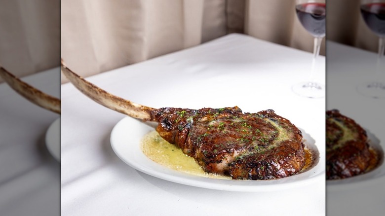 The 40-ounce USDA Prime Tomahawk Ribeye served with butter at Ruth's Chris Steak House