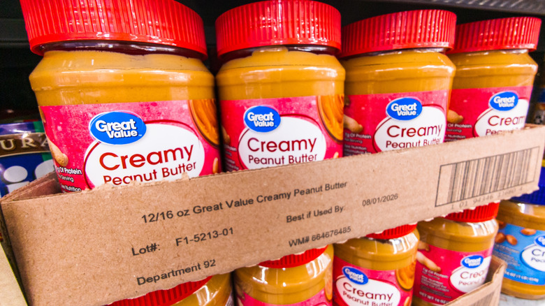 Jars of Great Value Creamy Peanut Butter on display in Walmart