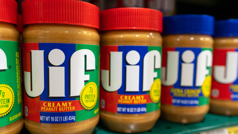 Jars of Jif Creamy Peanut Butter on display in store
