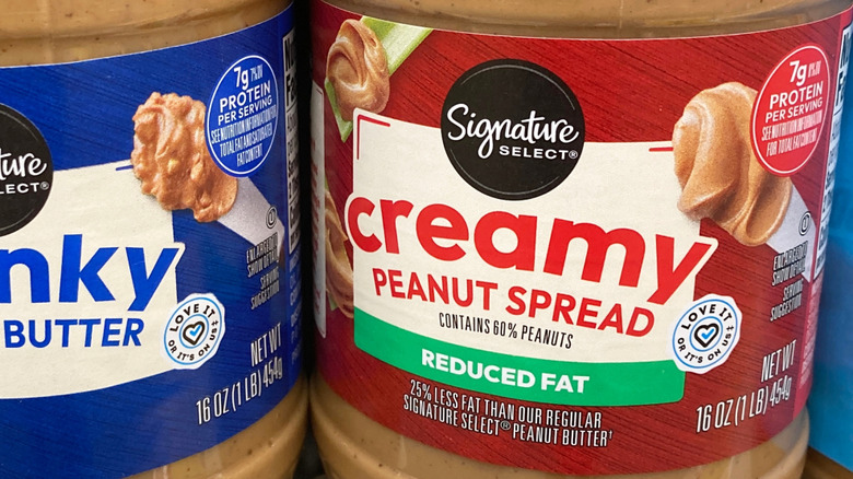 Close-up of the label on a jar of Signature Select Creamy Reduced Fat Peanut Butter