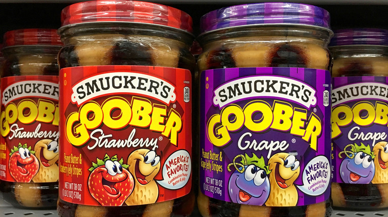 Jars of Smucker's Goober Peanut Butter in Strawberry and Grape flavors