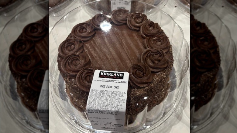 A Costco Chocolate Fudge Cake is encased in a clear plastic container