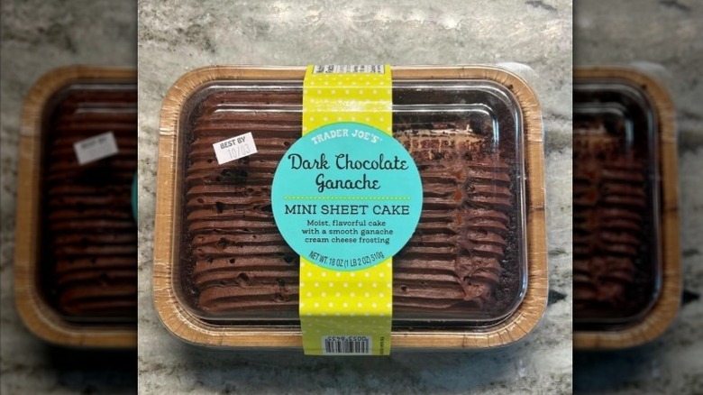 A Trader Joe's Dark Chocolate Ganache Mini Sheet Cake sits on a marble counter