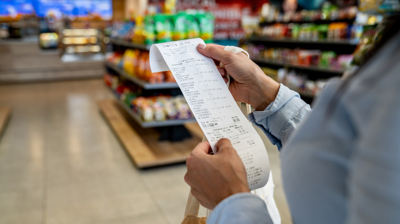 Person holding receipt