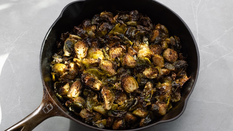 Roasted Brussels sprouts in a cast iron pan