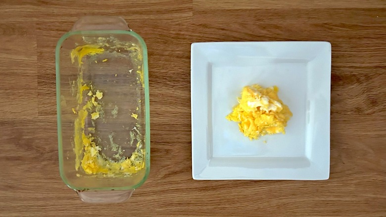Baking dish and square white plate of scrambled eggs