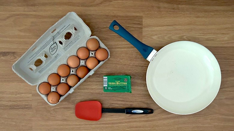 Dozen eggs, nonstick pan, stick of Irish butter, spatula