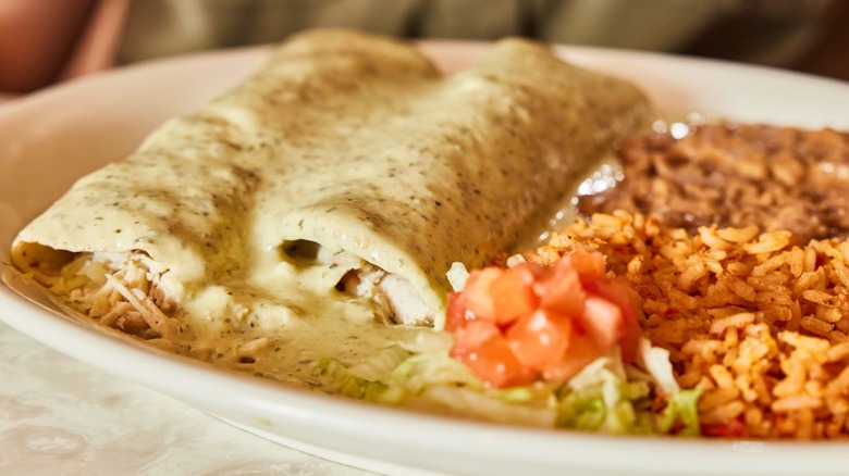 Mexican food sits on a plate.