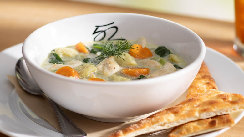 Soup sits in a bowl.