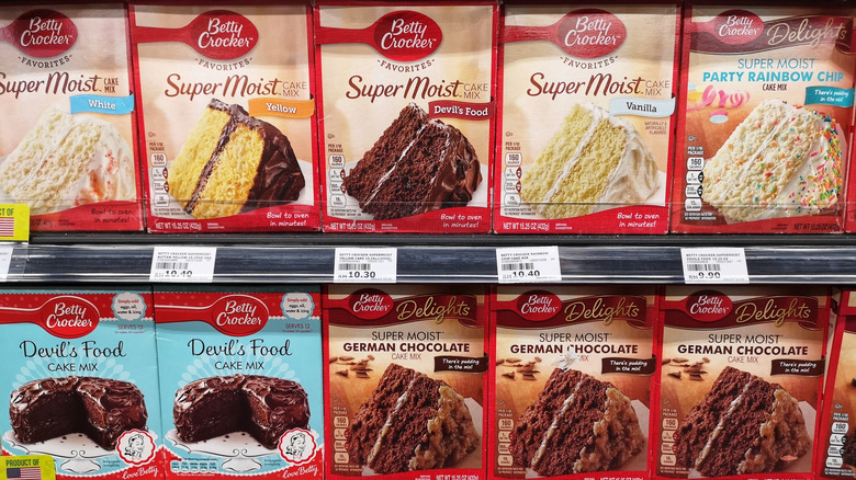 Aisle full of boxed cake mix at grocery store