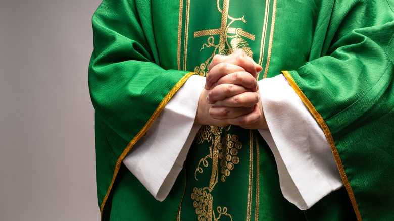 Priest with folded hands