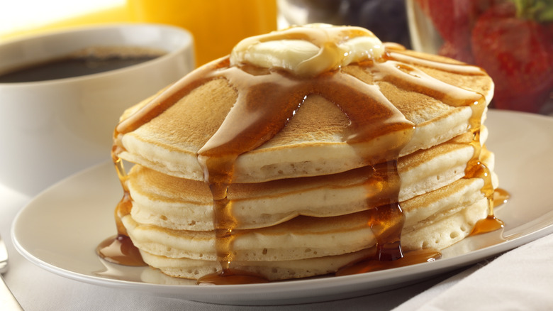Pancakes with coffee in background