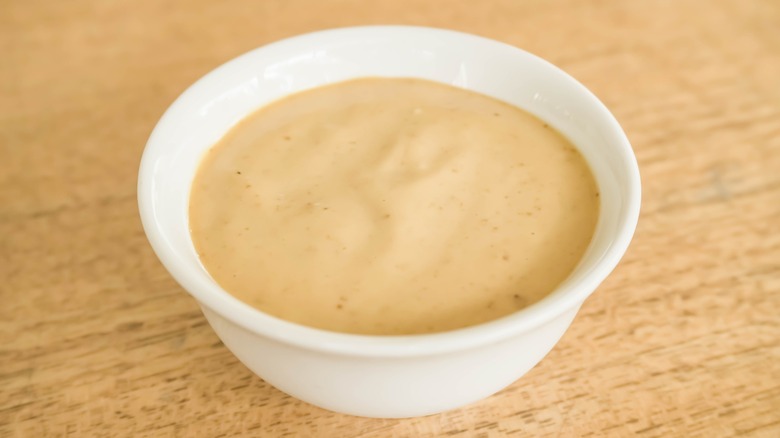 Homemade sesame oil mayonnaise in white bowl