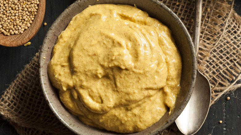 Brown mustard in earthenware bowl