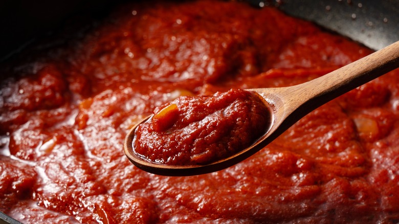 Canned tomatoes in saucepan
