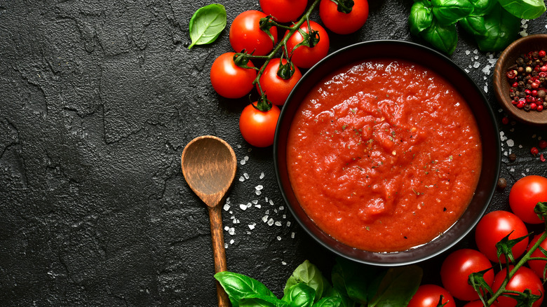 Strained  tomatoes on black slate