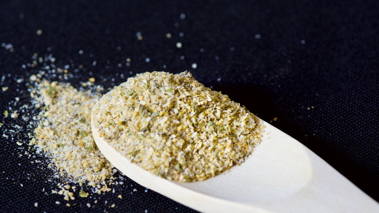 Garlic salt in wooden spoon