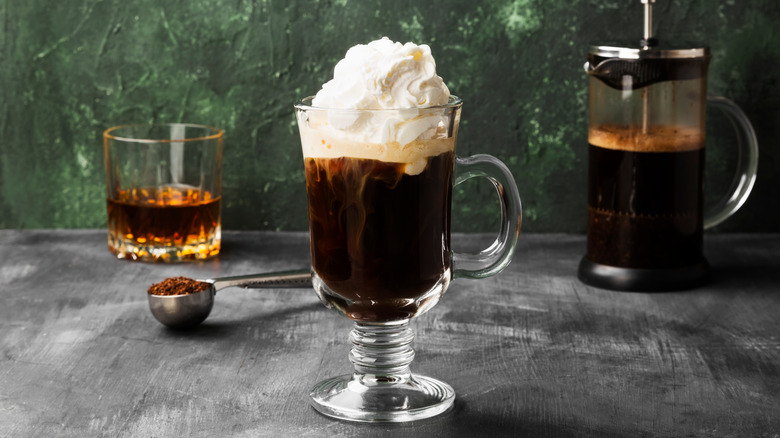 Irish coffee with a glass of whiskey