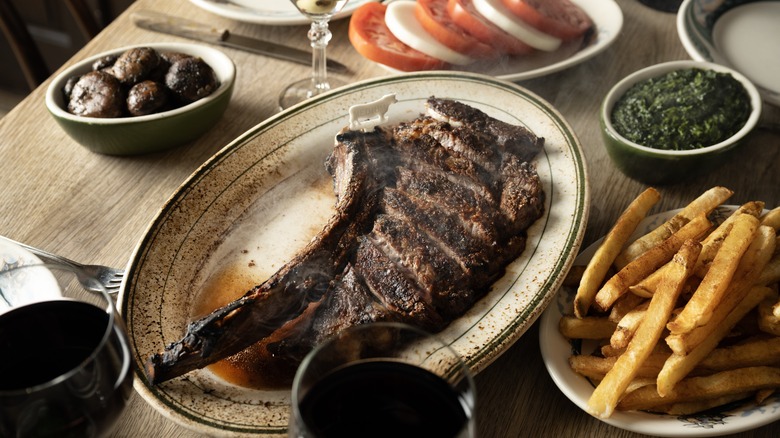 Steak ready to serve on a plate at Peter Luger Steak House 