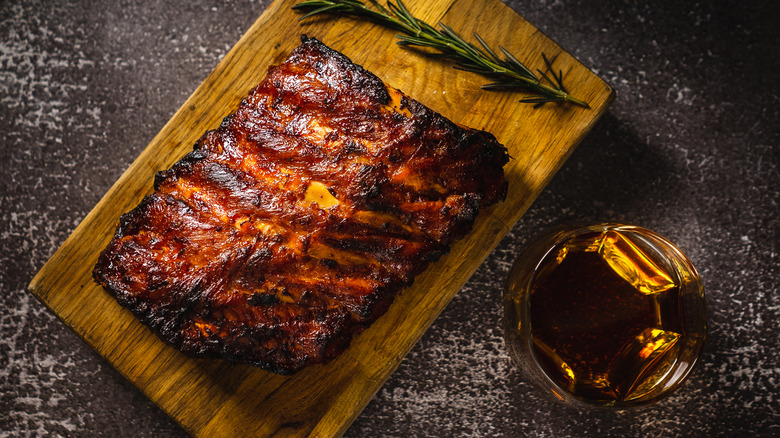 Barbecued ribs with glass of whiskey