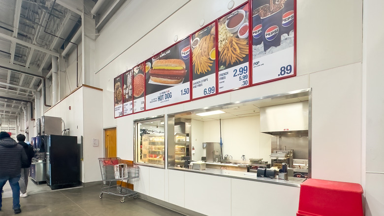 A Costco food court's overhead menu can be seen