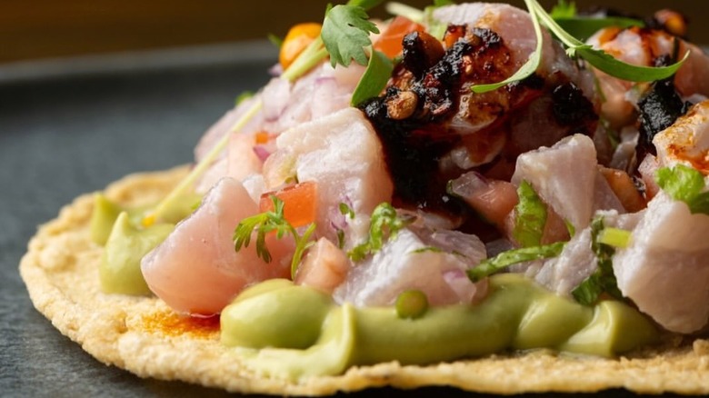 close up of a ceviche taco on a corn tortilla