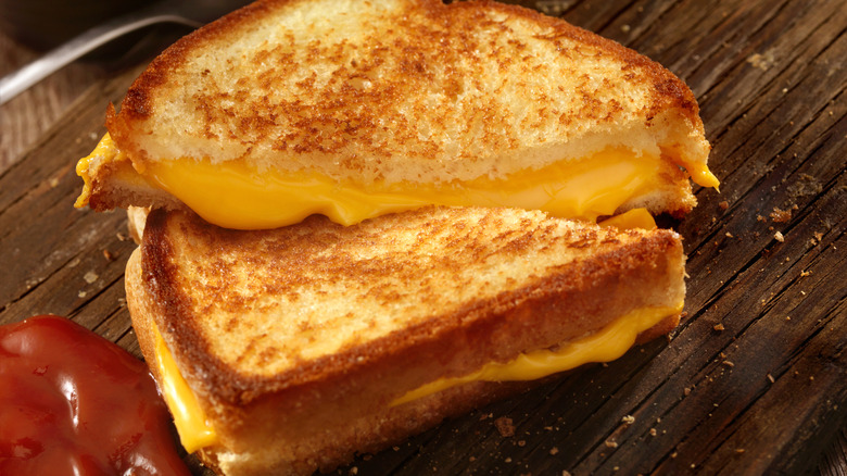 A grilled cheese sandwich cut in half