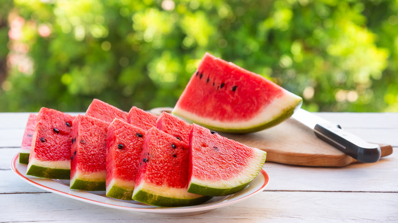Slices of watermelon outside on a table