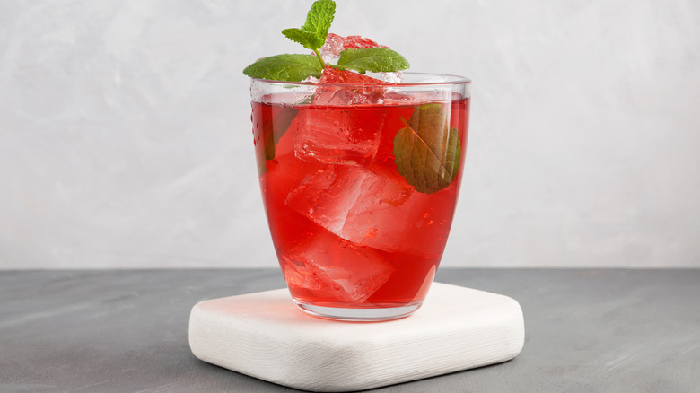 Red cocktail with clear ice