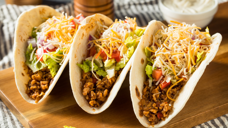 Beef tacos on a cutting board.