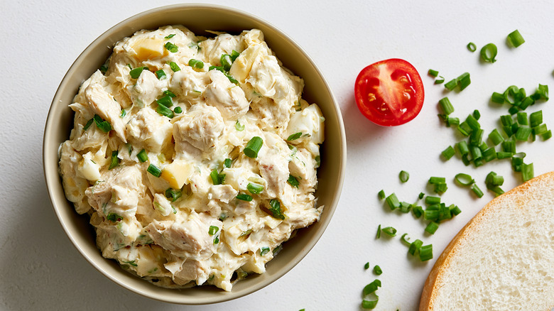 Bowl of chicken salad witht fresh chives.