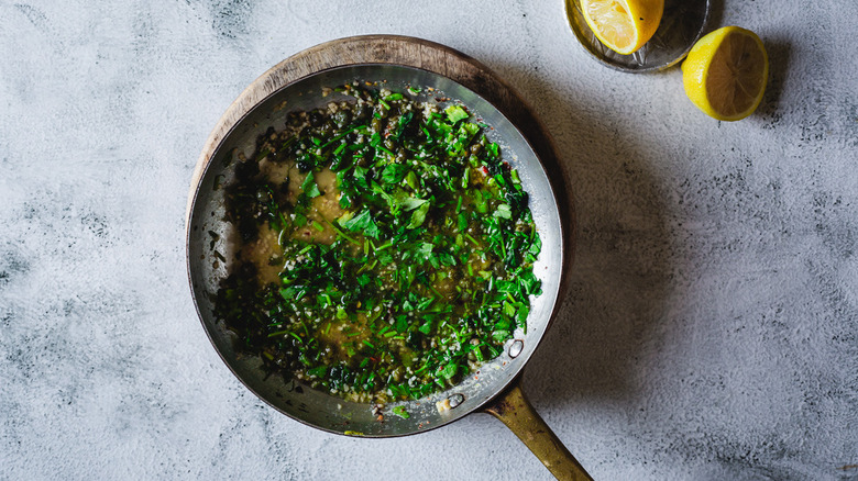 A bowl of garlic and herb butter.