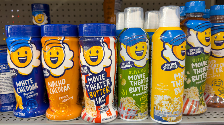 A variety of flavors of Kernel Season's popcorn seasoning on a grocery shelf