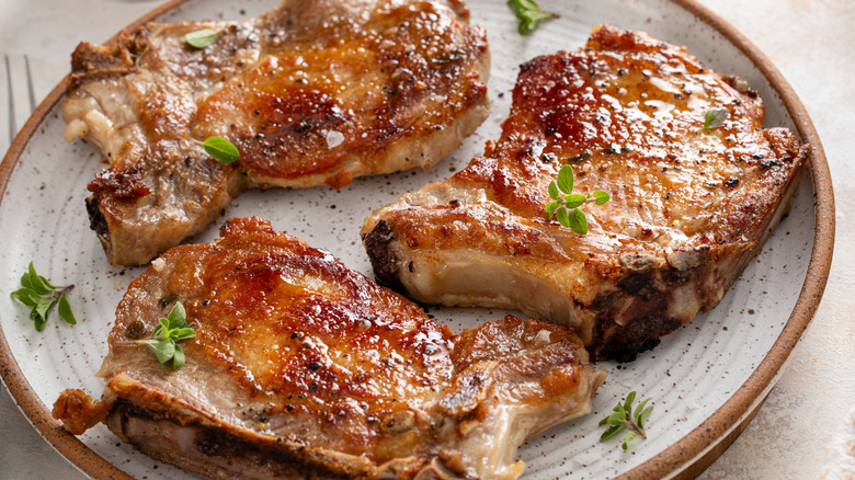 cooked pork chops on a plate