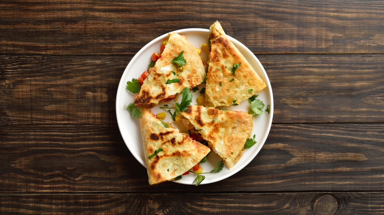 A plate of quartered quesadillas