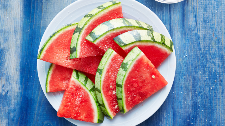 Salted watermelon with dish of salt