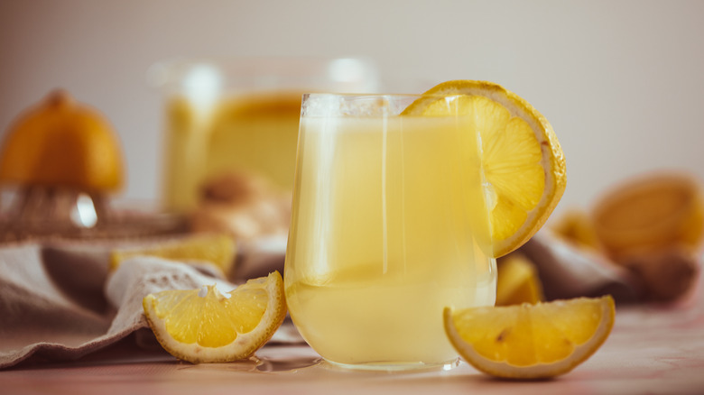 Glass of lemonade garnished with roasted lemon slice