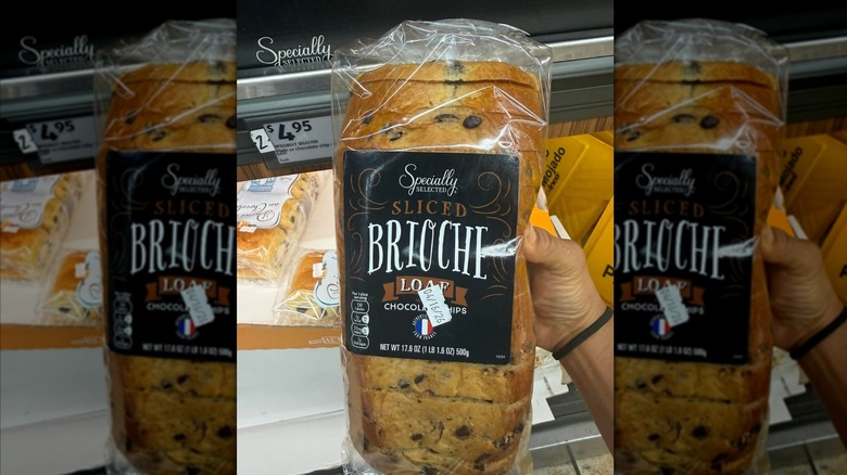 Customer holding a package of Specially Selected Chocolate Chip Brioche