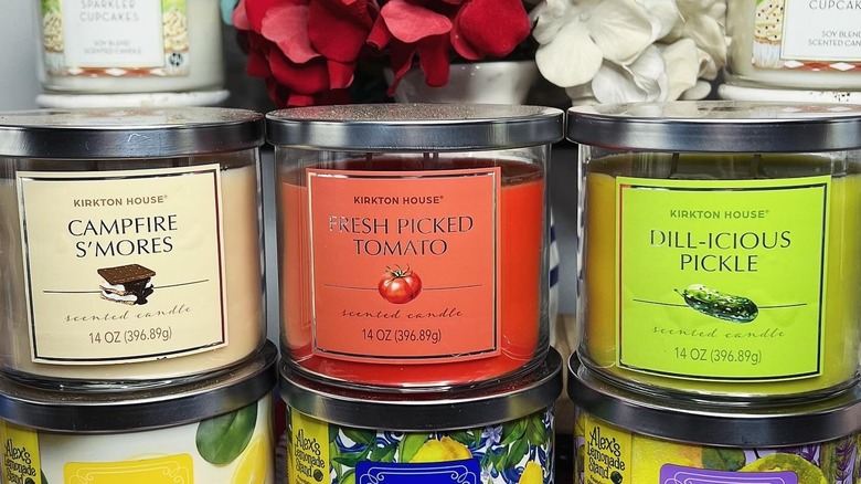 A set of Aldi's Kirkton House candles, including Campfire S'mores, Fresh Picked Tomato, and Dill-Icious Pickle