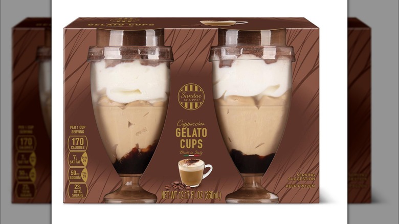 Two cups of gelato sit against a white background