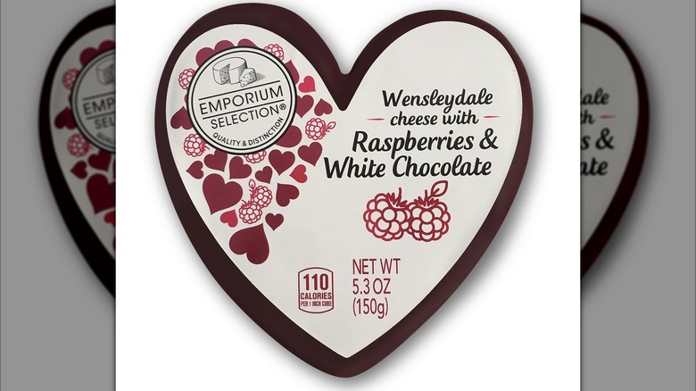 A heart-shaped cheese sits