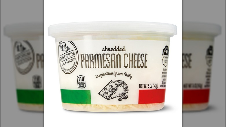 A tub of shredded parmesan cheese.