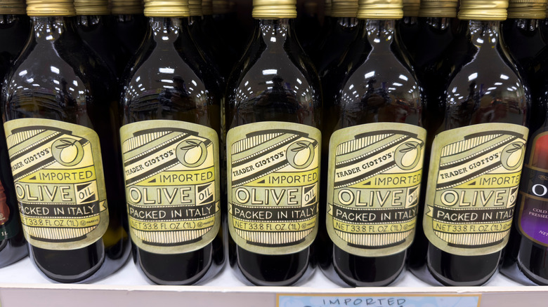 bottles of olive oil on shelves