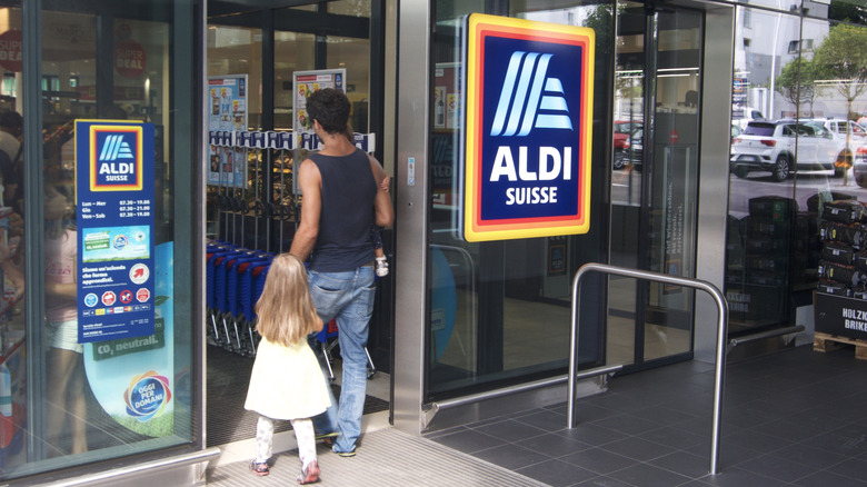 family walking into Aldi